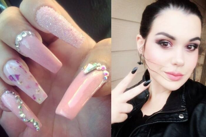 Amber holds up a peace sign and shows off her long and intricate nails.