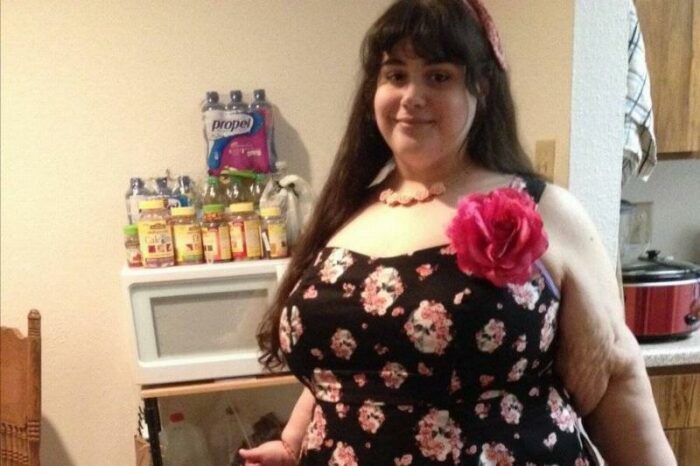 Amber poses in a dress after losing hundreds of pounds.